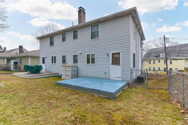 75 Columbus Ave Unit 75, Waltham, MA 02451 - back of property with a deck, a chimney, cooling unit, and a gate