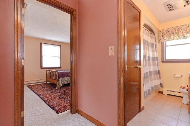75 Columbus Ave Unit 75, Waltham, MA 02451 - full bath with toilet, a baseboard radiator, and plenty of natural light