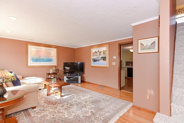 75 Columbus Ave Unit 75, Waltham, MA 02451 - living room featuring light wood-style floors, ornamental molding, recessed lighting, and baseboards