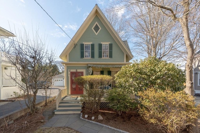 view of front of home with covered porch and a garage