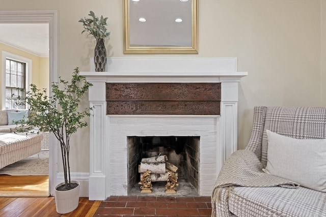 living area with wood finished floors and a fireplace