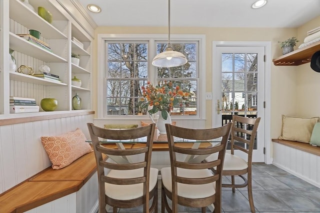 dining room with tile patterned flooring and recessed lighting