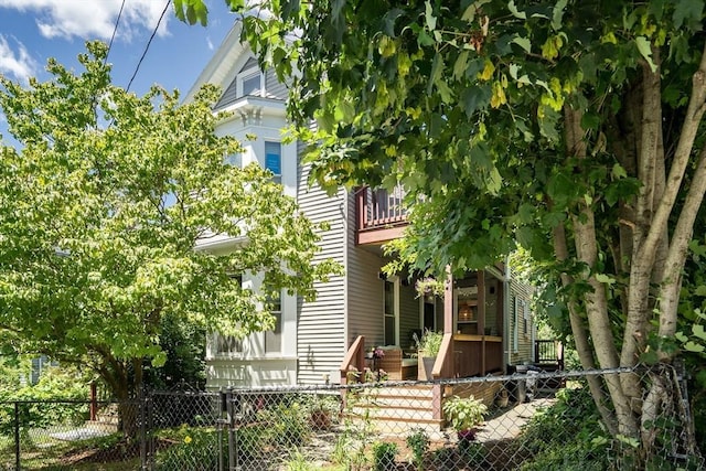 5 Mendell Way Unit 1, Boston, MA 02130 - back of property with a fenced front yard, a balcony, and a gate
