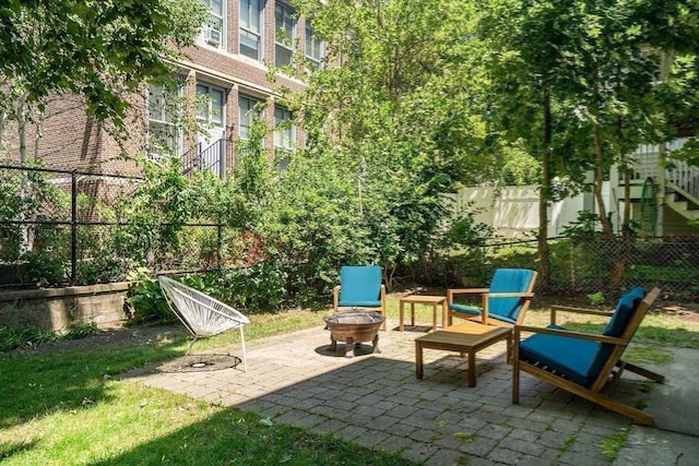 5 Mendell Way Unit 1, Boston, MA 02130 - fenced backyard featuring a fire pit and a patio area