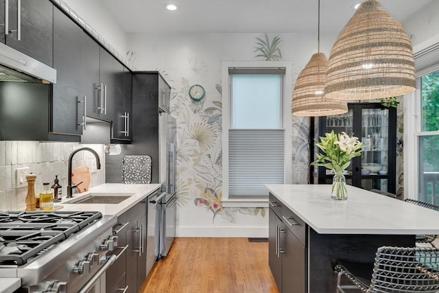 5 Mendell Way Unit 1, Boston, MA 02130 - kitchen with exhaust hood, light wood finished floors, light countertops, hanging light fixtures, and recessed lighting