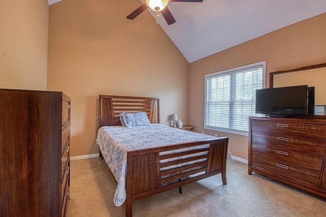 bedroom with vaulted ceiling, light colored carpet, baseboards, and ceiling fan