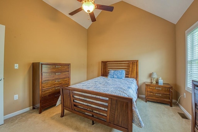 carpeted bedroom with high vaulted ceiling, baseboards, and a ceiling fan
