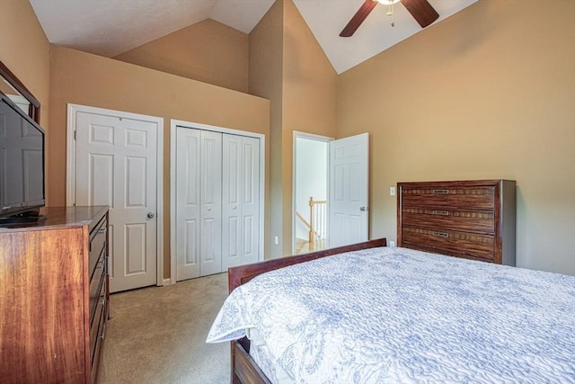 bedroom featuring light carpet, high vaulted ceiling, and a ceiling fan