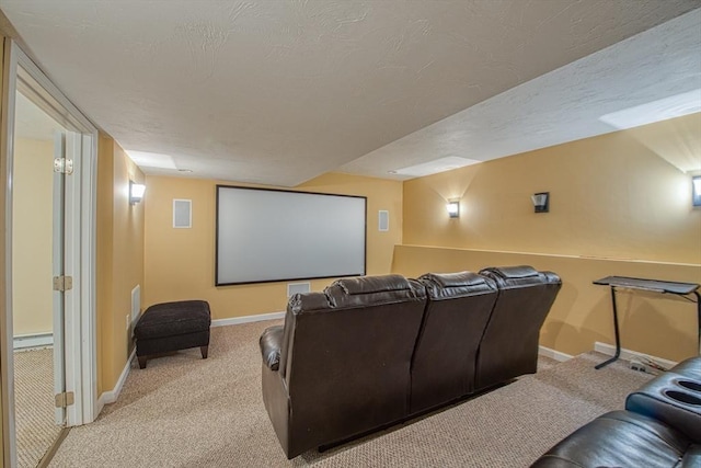 carpeted cinema room featuring baseboards and baseboard heating