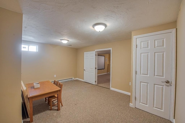 office with light colored carpet, baseboards, a textured ceiling, and a baseboard radiator
