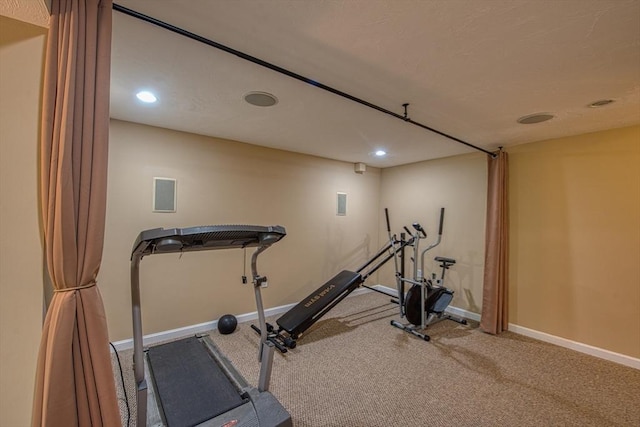 workout area with carpet floors, recessed lighting, and baseboards