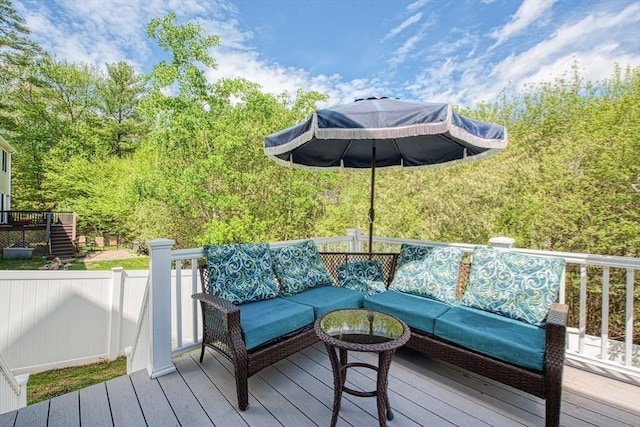 wooden terrace with an outdoor hangout area