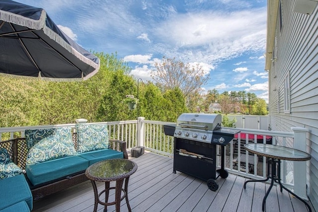 wooden deck featuring area for grilling