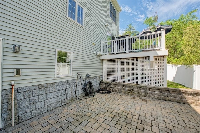view of patio / terrace with fence and a wooden deck