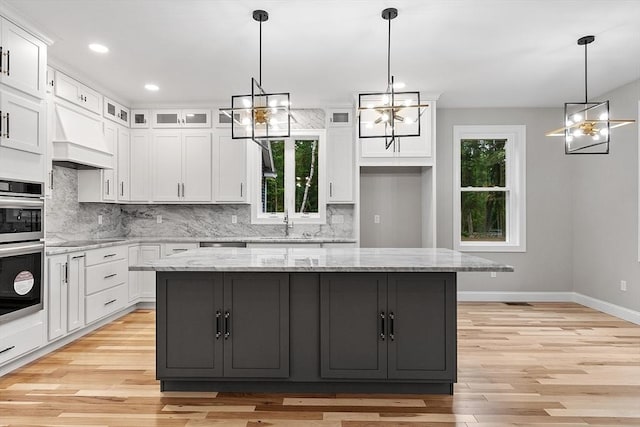 62 Bolton Rd Oakmont, Unit Oakmont, Westminster, MA 01473 - kitchen with a chandelier, white cabinets, baseboards, backsplash, and recessed lighting