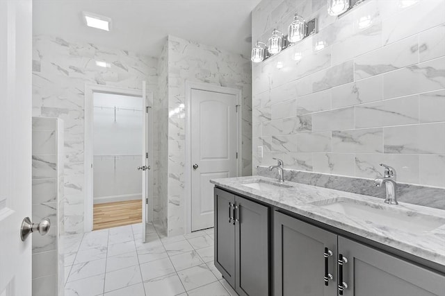62 Bolton Rd Oakmont, Unit Oakmont, Westminster, MA 01473 - full bath with marble look tiles, a walk in closet, and double vanity