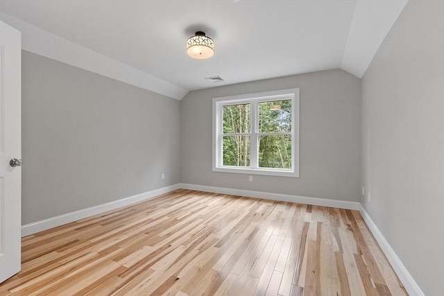 62 Bolton Rd Oakmont, Unit Oakmont, Westminster, MA 01473 - additional living space featuring vaulted ceiling, baseboards, and light wood-type flooring