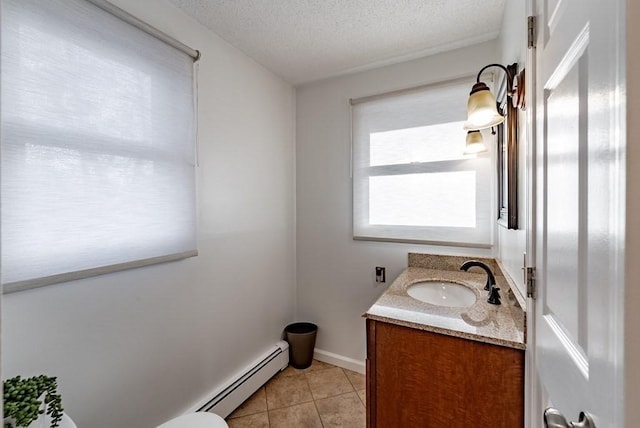 24 Shore Rd, Southwick, MA 01077 - half bath with a baseboard radiator, vanity, tile patterned floors, and a textured ceiling