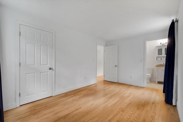 25 Liam Ln, Barnstable, MA 02632 - unfurnished bedroom with light wood-style floors and ensuite bath