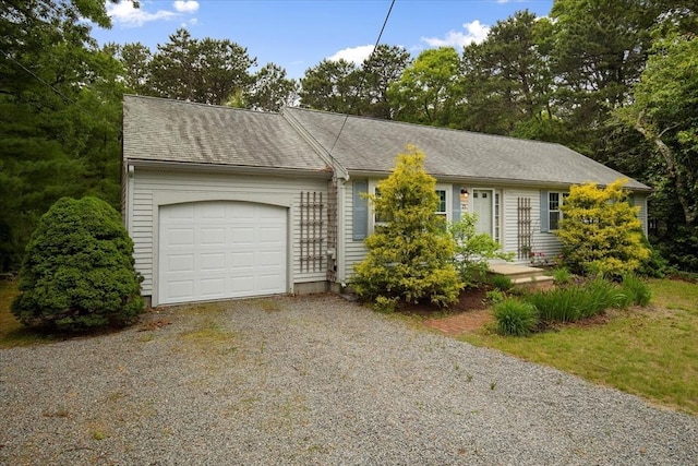 25 Liam Ln, Barnstable, MA 02632 - view of front facade with driveway and an attached garage