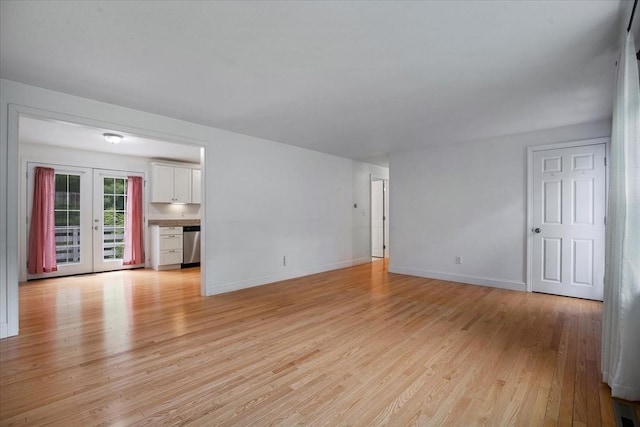 25 Liam Ln, Barnstable, MA 02632 - unfurnished living room with light wood-style floors and french doors