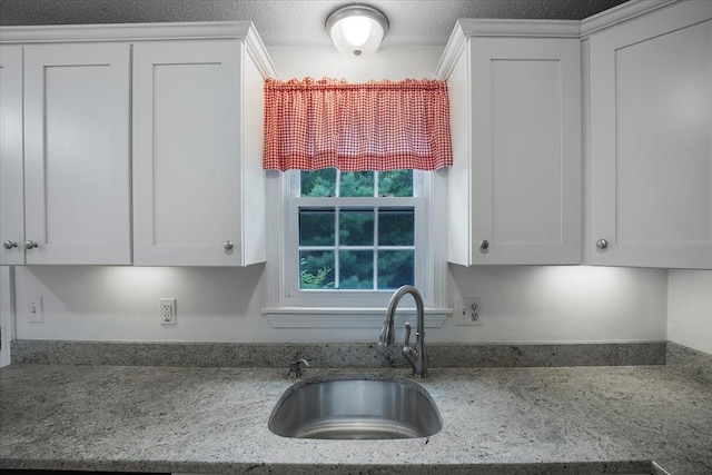 25 Liam Ln, Barnstable, MA 02632 - kitchen featuring white cabinetry and light stone counters