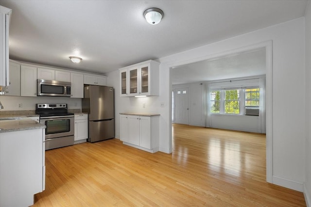 25 Liam Ln, Barnstable, MA 02632 - kitchen with stainless steel appliances, light wood finished floors, glass insert cabinets, white cabinets, and cooling unit