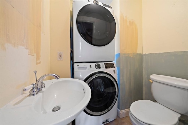 60 Holbrook Rd, Weymouth, MA 02191 - bathroom with stacked washer and clothes dryer and a sink