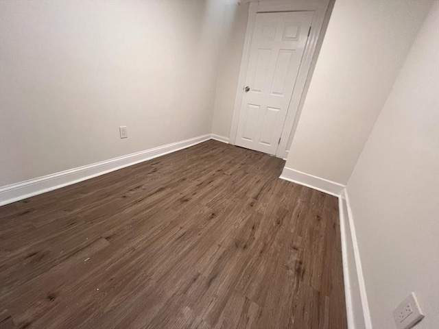 spare room featuring dark hardwood / wood-style flooring