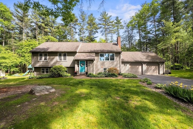 18 Arend Cir, Hanover, MA 02339 - bi-level home with a chimney, a front lawn, and a detached garage