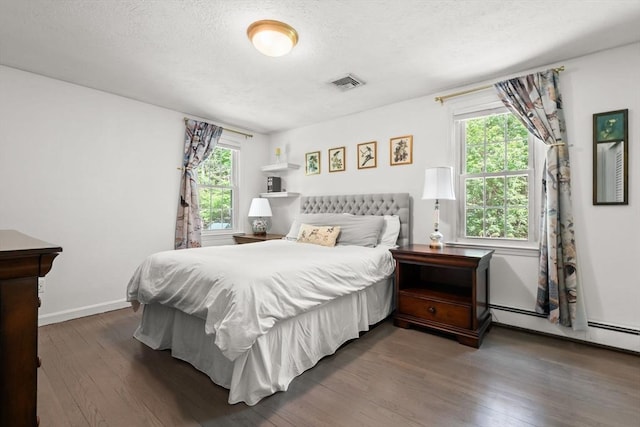 18 Arend Cir, Hanover, MA 02339 - bedroom with wood finished floors, multiple windows, a textured ceiling, and baseboards