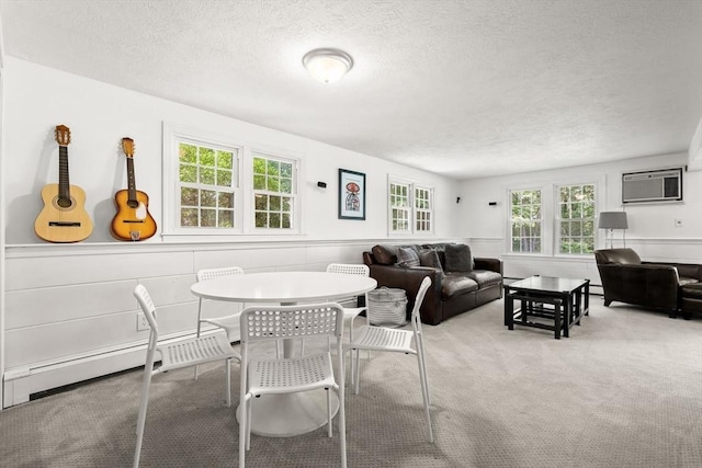 18 Arend Cir, Hanover, MA 02339 - dining area with an AC wall unit, a textured ceiling, carpet, wainscoting, and a baseboard radiator