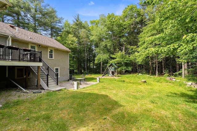 18 Arend Cir, Hanover, MA 02339 - view of grassy yard featuring a playground, a patio, stairway, and a wooden deck
