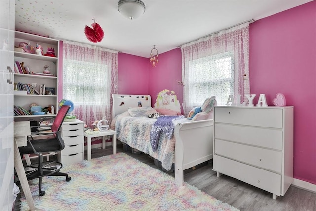 35 Linden Ter, Lynn, MA 01902 - bedroom featuring multiple windows, wood finished floors, and an office area