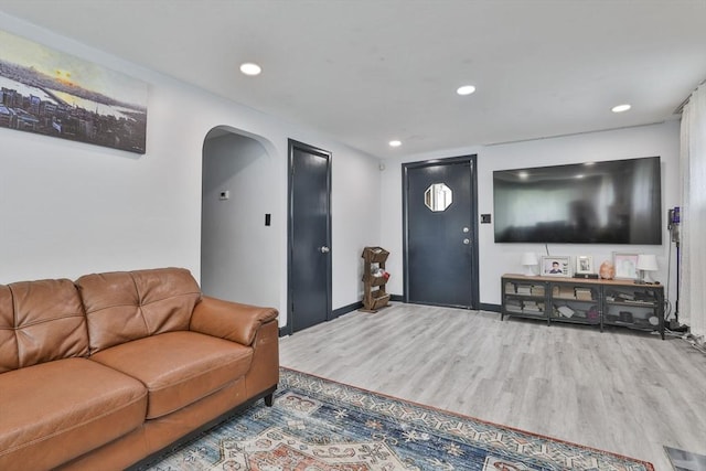 35 Linden Ter, Lynn, MA 01902 - living room with wood finished floors, arched walkways, recessed lighting, and baseboards