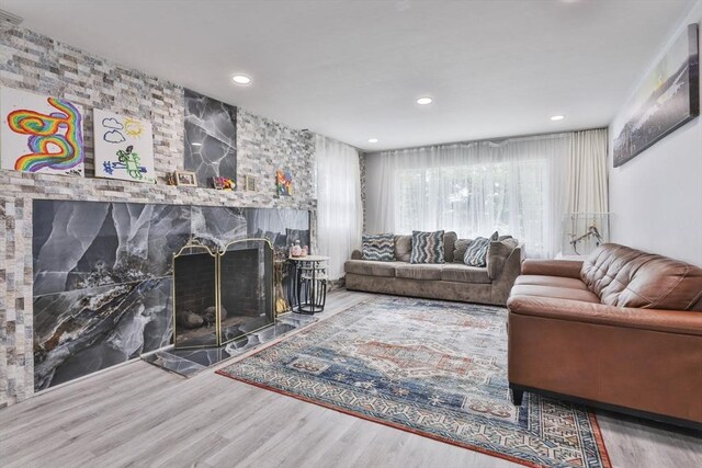 35 Linden Ter, Lynn, MA 01902 - living room with wood finished floors, a fireplace, and recessed lighting