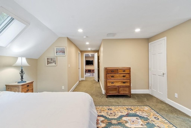 bedroom featuring light carpet, baseboards, a skylight, and recessed lighting