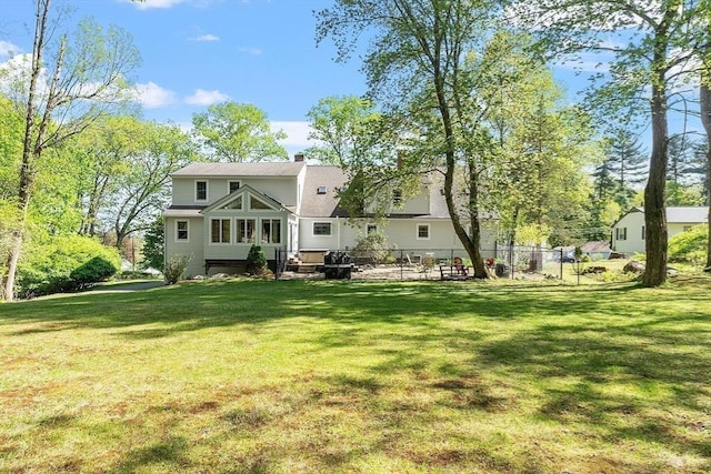 back of property with a chimney
