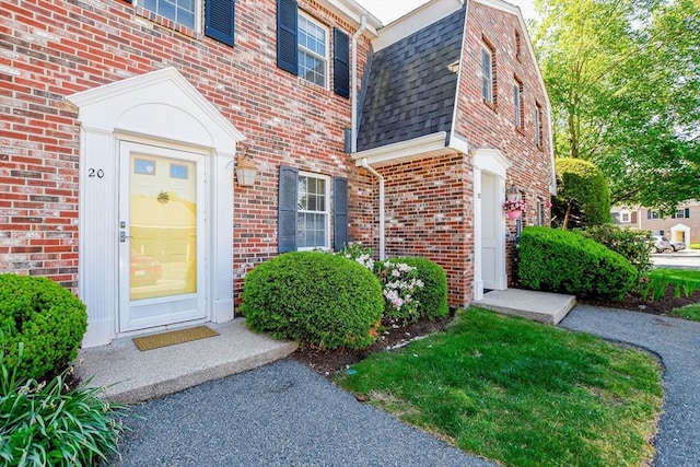 20 Patricia Dr Unit 20, Stoughton, MA 02072 - entrance to property with brick siding, a shingled roof, and mansard roof