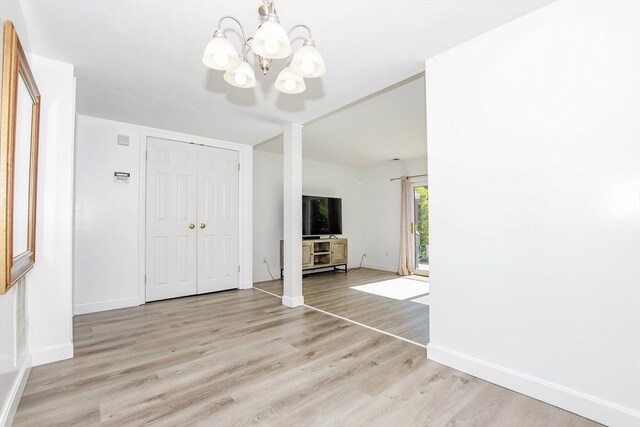 20 Patricia Dr Unit 20, Stoughton, MA 02072 - unfurnished living room featuring a chandelier, light wood-style flooring, and baseboards