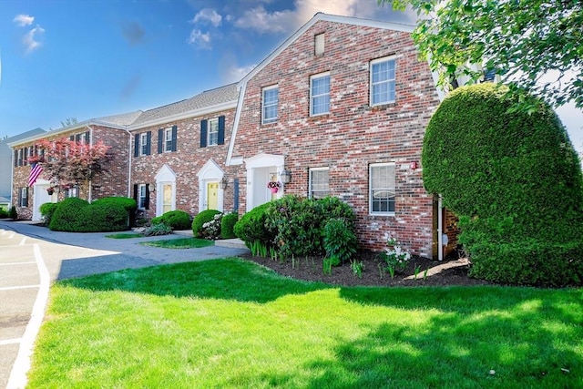 20 Patricia Dr Unit 20, Stoughton, MA 02072 - view of front facade with a front yard and brick siding