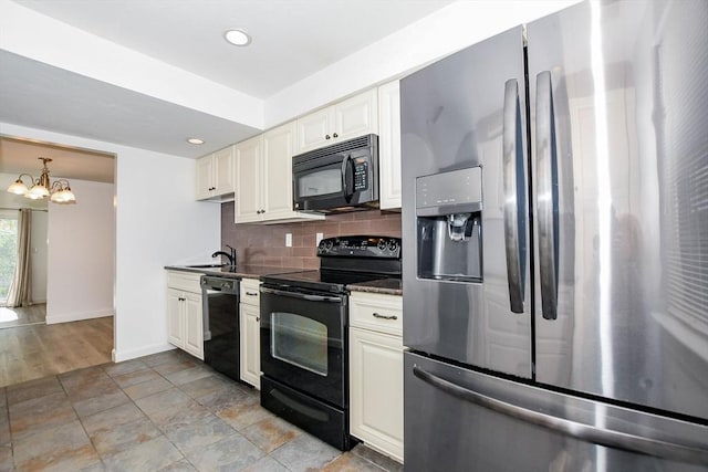 20 Patricia Dr Unit 20, Stoughton, MA 02072 - kitchen featuring black appliances, tasteful backsplash, a chandelier, a sink, and baseboards