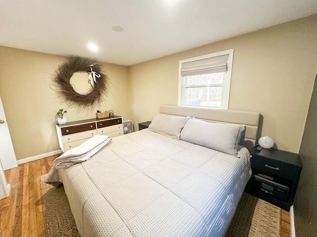 bedroom with hardwood / wood-style floors