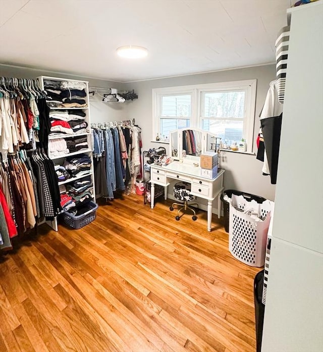 walk in closet featuring light hardwood / wood-style flooring