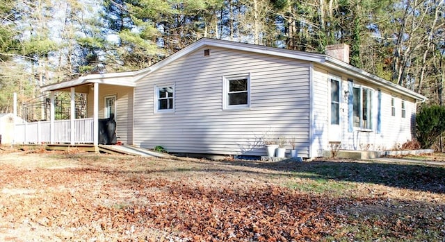 view of home's exterior featuring covered porch