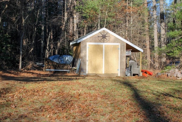 view of outbuilding with a lawn