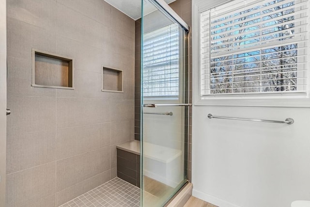 full bathroom with a shower stall