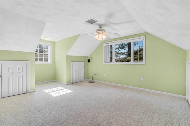 bonus room featuring carpet, vaulted ceiling, baseboards, and visible vents