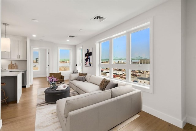 301 Border Unit 409, Boston, MA 02128 - living area with light wood-style floors, recessed lighting, and baseboards