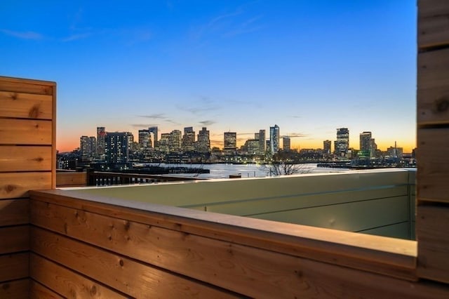 301 Border Unit 409, Boston, MA 02128 - balcony at dusk with a view of skyline and a water view